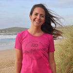 'Surf Kernow Seal' - Hot pink organic cotton surf t-shirt – Modelled by local surfer Dannie at Fistral beach in Newquay, Cornwall.