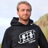 'Surf Kernow Logo' - Black organic cotton hoodie – Modelled by local surfer JB at Fistral beach in Newquay, Cornwall.